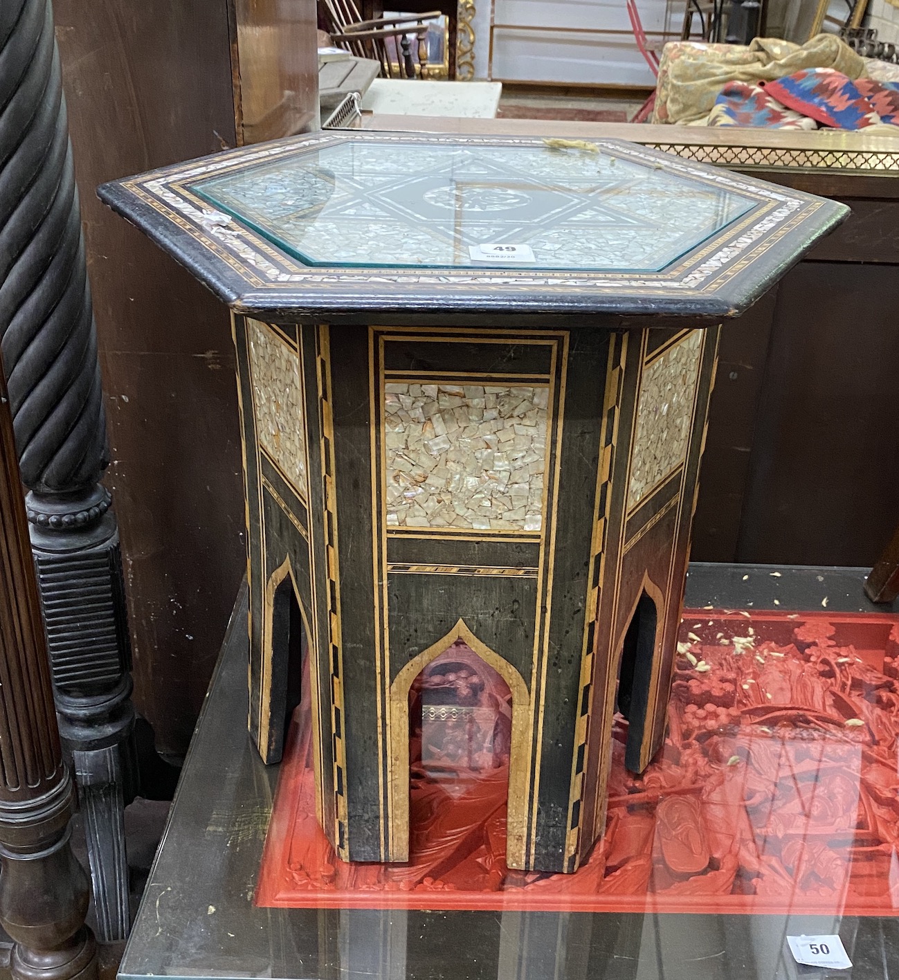 An early 20th century Moorish mother of pearl inlaid hexagonal occasional table, width 49cm, height 50cm